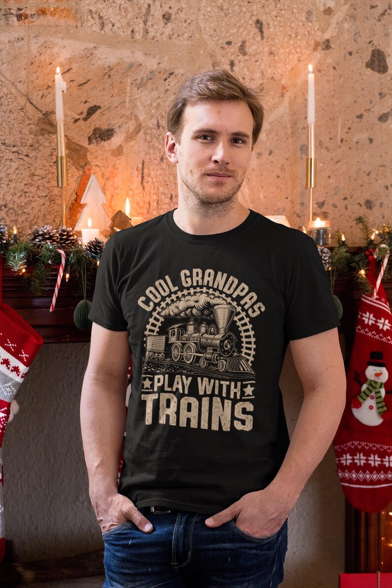 a man standing in front of a christmas tree