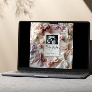 May include: A laptop screen displaying a digital announcement for a baby shower. The announcement features a black and white ultrasound image, pink and white bows, and the text "Baby Miller, October 2023".