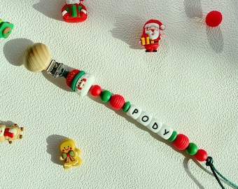 Attache-tétine personnalisée de Noël – Nom personnalisé avec motifs festifs | Attache-tétine apaisante pour nouveau-né | Cadeau de Noël idéal pour bébé garçon et fille