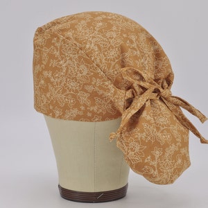 Ponytail Scrub Cap - Flowers on mustard Surgical Cap for Women with Satin Lined Option.