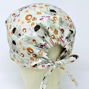 Cat surgical scrub cap with tie back for men. Funny skull tie-back style surgical scrub hat.