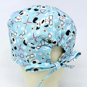 Dog surgical cap with tie back for men. Cute skull tie-back style surgical scrub hat.