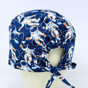 Space surgical cap with tie back for men. Astronaut skull tie-back style surgical scrub hat.