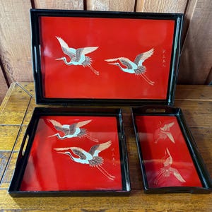 May include: A set of three ceramic mugs with a speckled, matte finish. The mugs are in shades of cream, light gray, and dark gray. Each mug has a simple, minimalist design, perfect for coffee or tea.