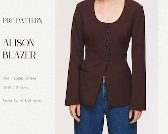 May include: A brown blazer with a scoop neckline and a button front. The blazer has a fitted waist and a long, pointed hem. The blazer is shown on a model wearing blue jeans.