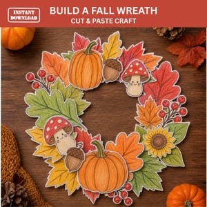 May include: A DIY fall wreath craft project featuring cut-out paper illustrations of orange pumpkins, red and yellow autumn leaves, brown acorns, red berries, and smiling mushrooms. The text at the top reads BUILD A FALL WREATH CUT & PASTE CRAFT.