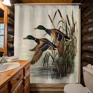 May include: Two mallard ducks in flight over a pond with tall green reeds. The ducks are flying in formation, with the lead duck in the foreground and the other duck behind it. The ducks are painted in a realistic style, with detailed feathers and markings.