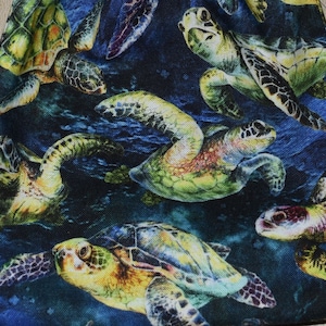 May include: A blue drawstring bag with a sea turtle pattern. The bag is filled with colorful dice.