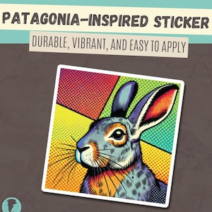 May include: A colorful sticker featuring a cartoon rabbit with a pop art style background. The rabbit is gray with orange and blue accents. The background is a mix of yellow, red, green, and blue.