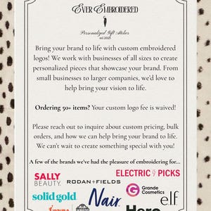 May include: A white rectangular sign with black text reading Ever Embroidered Personalized Gift Atelier est 2025. The text describes custom embroidery services for brands and lists logos including Sally Beauty, Rodan+Fields, Electric Picks, Solid Gold, Nair, Grande Cosmetics, elf, WNBA, WNBPA, and Hero.