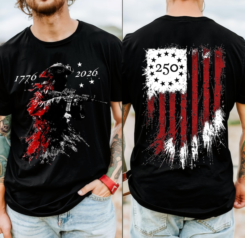 May include: A black t-shirt featuring a graphic on the front and back. The front displays a silhouette of a soldier with a rifle, the text 1776 and 2026, and stars. The back shows a distressed American flag design with the number 250 inside a circle.