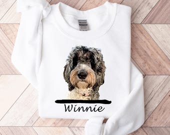 May include: White sweatshirt with a black and white dog illustration and the name "Winnie" printed below.