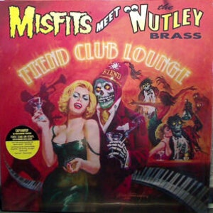 May include: A vinyl record album cover featuring a colourful illustration of a skeleton wearing a red fez with the words "Fiend Club Lounge" in large, white letters. The album is titled "Misfits Meet the Wutley Brass".