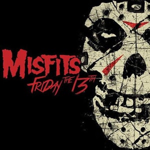 May include: A black and white graphic design of a hockey mask with red slashes. The text "Misfits Friday the 13th" is in red.