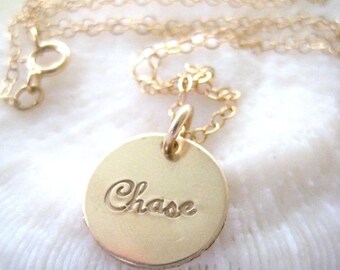 A Single Gold Disc Necklace Personalized in Script