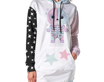 May include: White hoodie dress with a cartoon skeleton design. The dress features a black sleeve with white stars, a light blue hood, and a kangaroo pocket with star graphics. The skeleton is pink and blue.