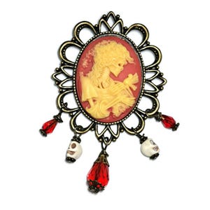 Vintage Gothic Skeleton Cameo Brooch with Red Gem and Skull Accents