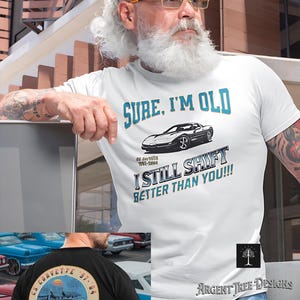 May include: White t-shirt with the text "SURE, I'M OLD" and a graphic of a Corvette. The shirt also says "I STILL SHIFT BETTER THAN YOU!!!" and "CS Corvette 1997-2004". The back of the shirt is black with a Corvette graphic.