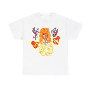 May include: White t-shirt with a colorful illustration of a clown with red hair and hands, wearing a necklace and surrounded by yellow and white shapes.