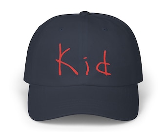 May include: A navy blue baseball cap with a red embroidered word "Kid" on the front.