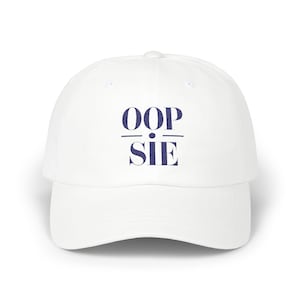 May include: White baseball cap with blue embroidered text that reads "OOP-SIE"