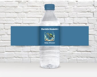 May include: A blue water bottle with a label that says "Charlotte Elizabeth's Baby Shower" and features a green sea turtle swimming in the ocean.