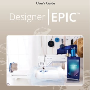 May include: A white sewing machine with a blue and white embroidery hoop, a blue and white embroidery design on the fabric in the hoop, and a blue and white embroidery design on the screen of the machine. The machine is on a white table with a white background. The text "Designer EPIC" is on the top of the image.