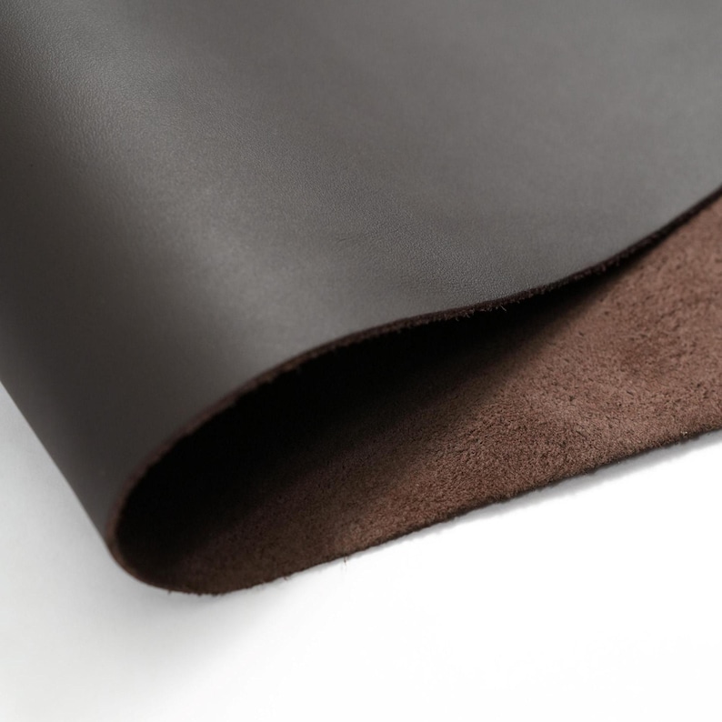 Close up view of top grain premium Italian leather, 4.5-5 oz, brown leather ideal for crafting projects like bags, wallets, and accessories.