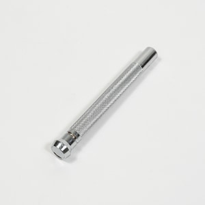 May include: A silver metal tool with a textured, diamond-patterned grip. The tool has a cylindrical shape with a flat, hexagonal end. The tool is designed for a specific purpose, likely related to crafts or mechanics.