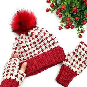 May include: Red and white crocheted hat with a red pom pom and matching fingerless gloves.