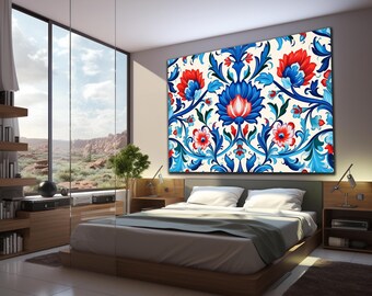 May include: A large rectangular wall art piece featuring a symmetrical floral pattern with vibrant red and blue petals, intricate swirling blue leaves, and stems set against a cream-coloured background, displayed above a low-profile bed frame.