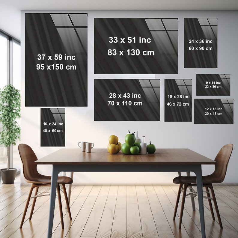 May include: A mock-up of a dining room with a wooden table and chairs. The wall behind the table is decorated with eight framed prints of abstract black and white images. The prints are of various sizes and are arranged in a staggered pattern. The text on the prints includes the dimensions of the prints in inches and centimeters.