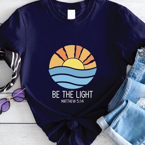 Retro Be The Light Matthew 5:14 Christian Shirt, Boho Bible Verse Sunburst Sea Sun Religious Jesus God Shirt,Inspirational Blessed Shirt