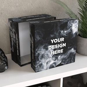 May include: Black rectangular box with a smoky white design and the text "YOUR DESIGN HERE" in white. The box is open, revealing a white interior. The box is on a white surface.