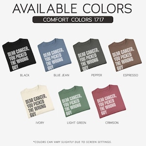 Peut inclure: Pr&eacute;sentation de t-shirts de diff&eacute;rentes couleurs, chacun avec le texte "DEAR CANCER, YOU PICKED THE WRONG GUY" en blanc. Les couleurs incluent noir, bleu jean, poivre, expresso, ivoire, vert clair et cramoisi. Le texte "AVAILABLE COLORS" est en haut.