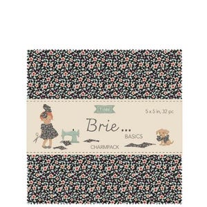 May include: A fabric charm pack with a floral pattern in black, pink, and white. The label reads "Tilda Brie... Basics Charmpack" with illustrations of a girl, sewing machine, and dog. Each square measures 5 x 5 inches.