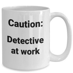 Detective coffee mug funny gift idea for police officer coworker boss promotion new job t-shirt travel mug
