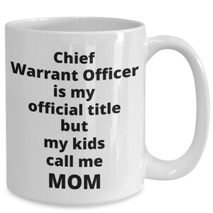 May include: White ceramic coffee mug with black text that reads "Chief Warrant Officer is my official title but my kids call me MOM".