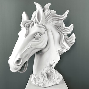 May include: A white horse head sculpture with detailed mane and facial features. The sculpture is mounted on a square pedestal, showcasing a classical design. The horse head is a decorative item.