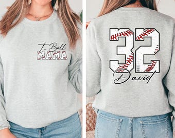 May include: Gray sweatshirt with the text "T-Ball Mama" on the front and a baseball with the number "32" and the name "David" on the back.