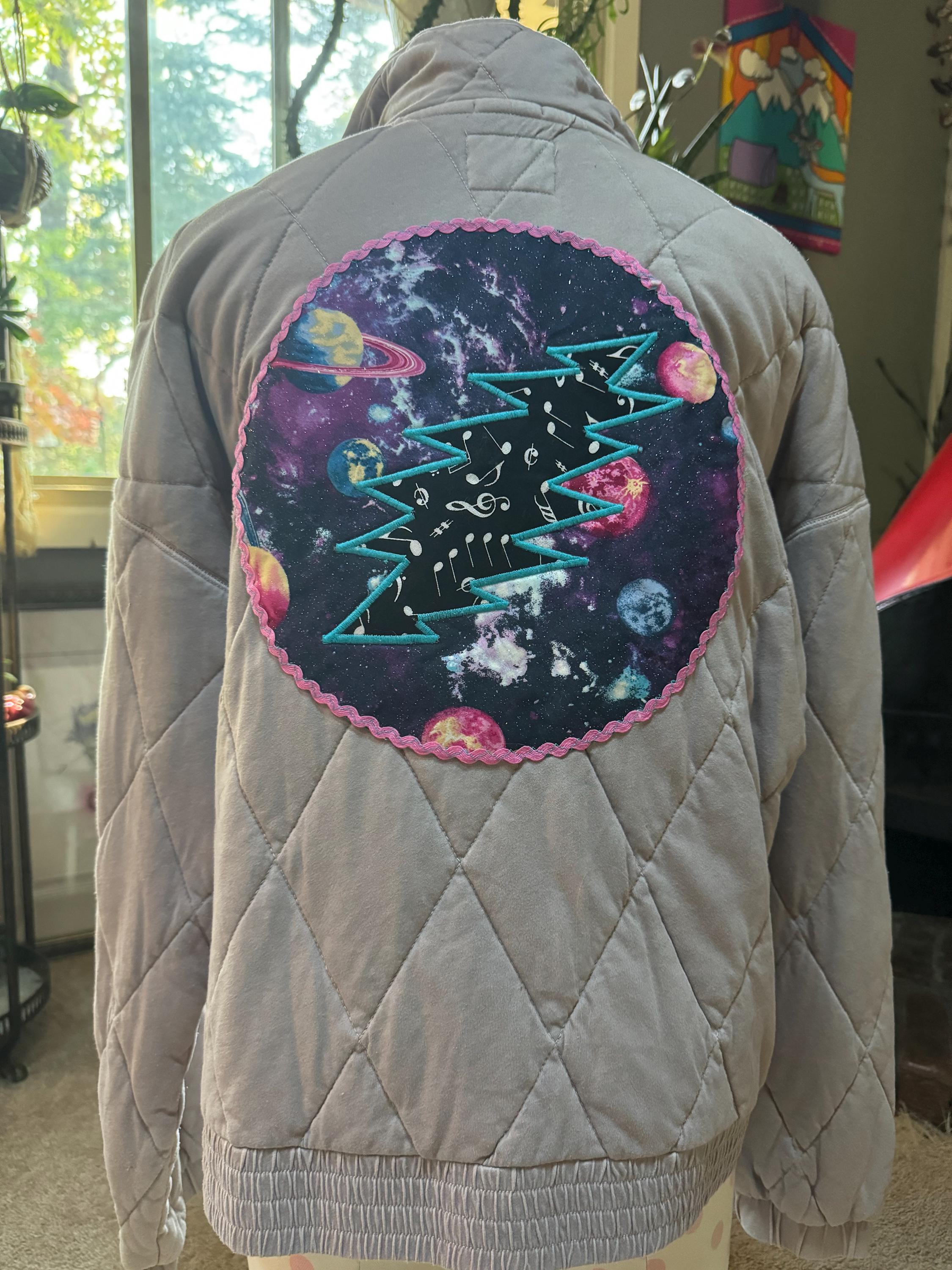 Lavender quilted jacket with grateful Dead space bolt patch