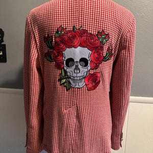 May include: Red and white gingham blazer with an embroidered skull and roses on the back.