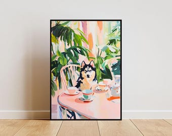 May include: A framed art print featuring a black and white husky dog sitting at a table set for tea. The table is pink, with white teacups and saucers. The background includes green foliage and a light-colored wall.