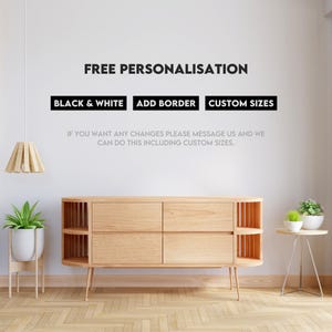 a room with a white wall and a wooden cabinet