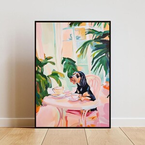 May include: A painting of a black and brown dog sitting at a pink table with two teacups and saucers. The dog is looking up at something off-screen. The background is a light pink and green with a window and plants.