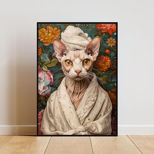May include: A Sphynx cat wearing a white towel on its head and a white robe, posed against a background of colorful flowers.