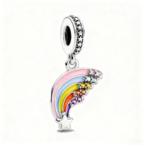 May include: A silver charm with a rainbow design. The rainbow features pink, blue, yellow, orange, and purple stripes, accented with colorful gemstones. A silver star is at the end of the rainbow. The charm has a silver loop with star-shaped details.