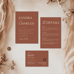 May include: A terracotta-coloured wedding invitation suite with white text. The invitation card features the names "Sandra and Charles" and details the wedding date, time, and location. The RSVP card includes a QR code and a section for guests to indicate their attendance.