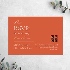 May include: An orange RSVP card with a QR code. The text reads "Please RSVP by 08. 20. 2025" and includes a line for a name and surname. The card has two checkboxes: "Joyfully accepts" and "Regretfully denies". The text also reads "Scan the QR code to reply or send your response through mail. Thank you!"
