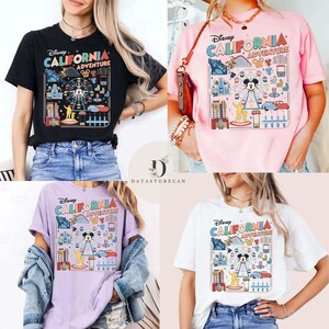 May include: Four t-shirts in black, pink, purple, and white, each featuring a colorful graphic design. The design includes the text "Disney CALIFORNIA ADVENTURE" with illustrations of a Ferris wheel, Mickey Mouse, and other theme park elements.